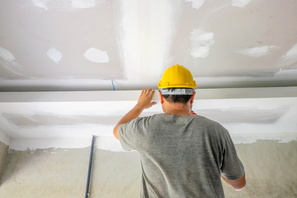 construction-workers-fill-ceiling-min